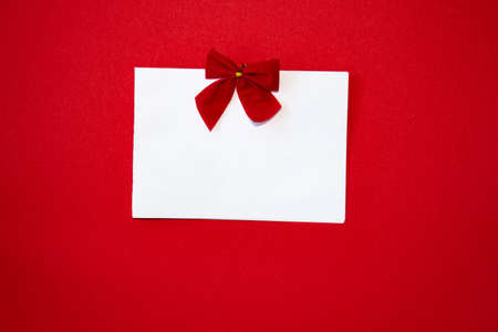 Valentines day congratulation. Red rose and greeting card with heart sign on black background top...