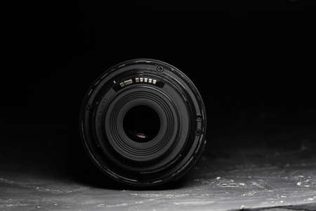 Camera lens on a dark background. Black background