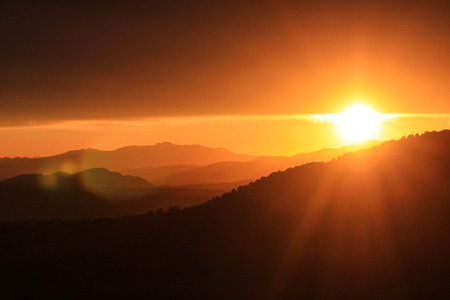 Peaking Sunset at mountain の写真素材