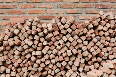 Brick tiles against brick wall background texture の写真素材