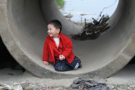 cuet little boy in Sewerの写真素材