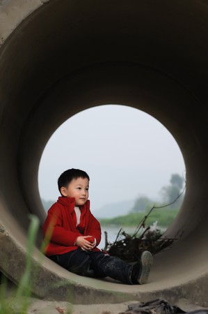 cuet little boy in Sewerの写真素材