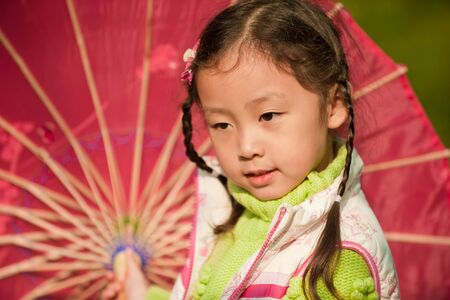  little girl with red Umbrellaの写真素材