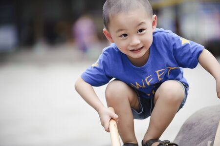 cute little boy Squattingの写真素材