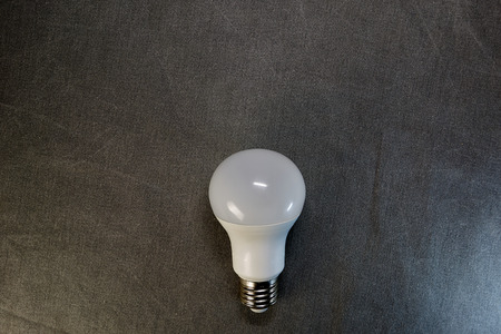 LED light bulb on a gray background.