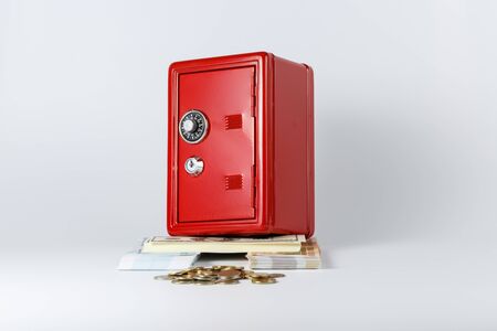 The red box stands on the basis of their bundles of dollars and rublesの写真素材