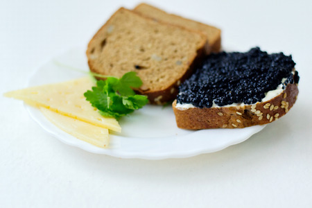 caviar sandwich on a white plateの写真素材