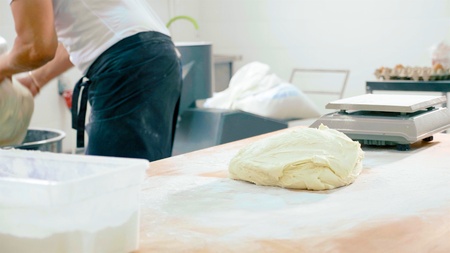 Dough on the table at commercial kitchen of bakery