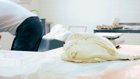 Dough on the table at commercial kitchen of bakeryの写真素材