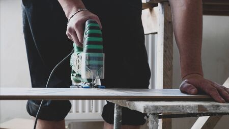 Laminate cutting process with an electric jigsaw.