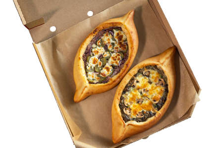 A craft box with two adjarian khachapuri, isolate. Food delivery concept.の写真素材