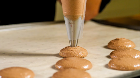 Chef making base for preparation macaron dessert.の写真素材