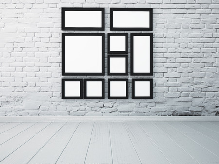 mock up frame black frames on the white wall in the interior.