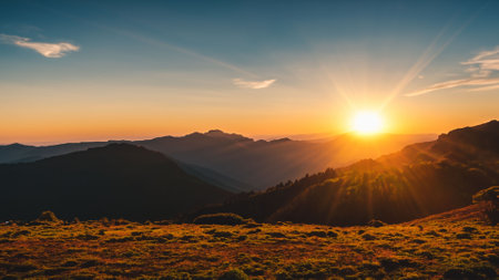 Beautiful sunset in the mountains landscape. View from the top of the mountain.の写真素材