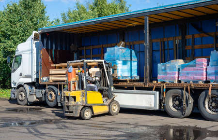 SAINT PETERSBURG, RUSSIA - SEPTEMBER 10, 2021: Loading of a truck with construction goodsのeditorial素材