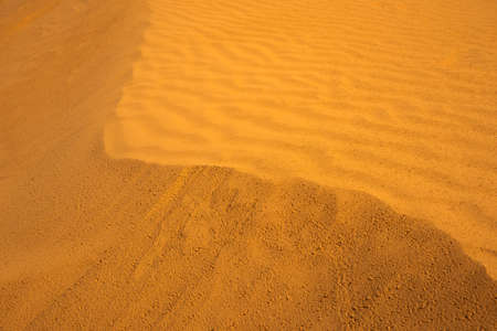 One of the dunes of the Black Lands desert on a sunny day. Republic of Kalmykia, Russiaの写真素材