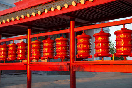 ELISTA, RUSSIA - SEPTEMBER 20, 2021: Buddhist prayer drums close-up. The Buddhist temple of Syakyusn-Syume. The neighborhood of Elista. Republic of Kalmykia, Russiaのeditorial素材