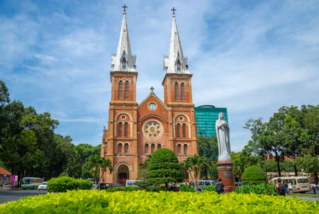 HO CHI MINH CITY, VIETNAM - DECEMBER 19, 2015: The ancient Cathedral of Notre Dame De Saigon in the urban landscape. Ho Chi Minh City, Vietnamのeditorial素材