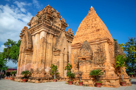 Two ancient Chaam towers of the temple complex Po Nagar on a sunny day. Nha Trang, Vietnam