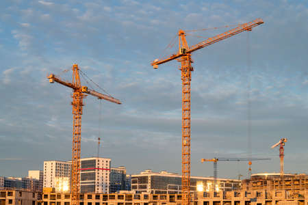 Cranes on the construction site of a new house. Saint Petersburg