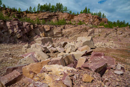 In an old abandoned quarry for the extraction of raspberry quartzite. Karelia