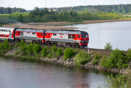 KARELIA, RUSSIA - JUNE 11, 2022: A tourist train passes over the dam. Kareliaのeditorial素材