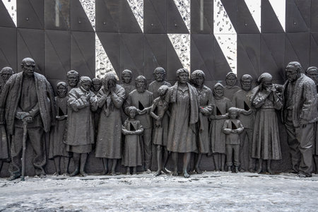 LENINGRAD REGION, RUSSIA - FEBRUARY 10, 2024: A fragment of the bas-relief of the memorial to the victims of the Nazi genocide. Leningrad region, Russiaのeditorial素材