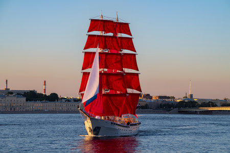 ST. PETERSBURG, RUSSIA - JUNE 27, 2024: Brigantine with scarlet sails in the waters of the Neva, St. Petersburg, Russiaのeditorial素材