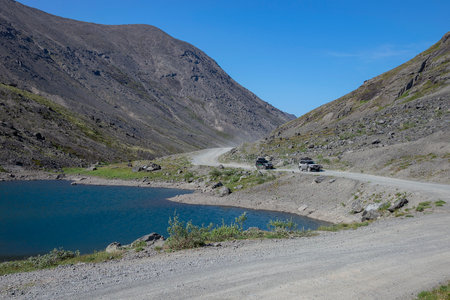 KHIBINY, RUSSIA - JULY 27, 2024: Highway along the lake shore. Khibiny, Murmansk region, Russiaのeditorial素材