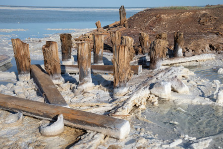 The remains of an old railway destroyed by salt and time. Baskunchak Lake, Astrakhan region. Russiaの写真素材