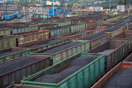 MURMANSK, RUSSIA - JULY 28, 2024: Freight wagons with coal, top view. Murmansk, Russia