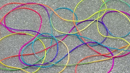 Multi-colored cord on a silver background