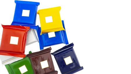 Chocolates in bright packaging on a white background