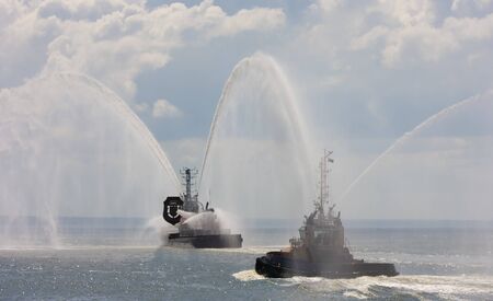 Rescue tugs extinguish fire at paradeの写真素材