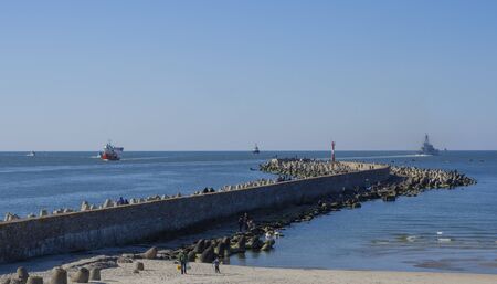 Port mall seagulls ships clear skiesの写真素材