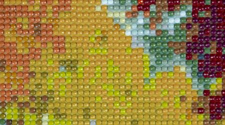 Colored mosaic with orange, red, yellow and blue pebblesの写真素材