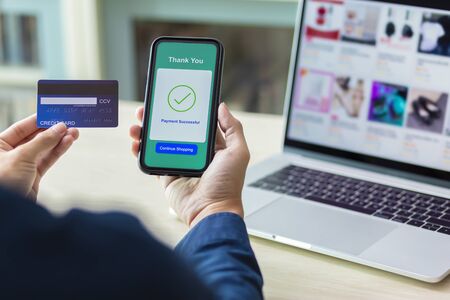 using smartphone and credit card online shoppingの写真素材