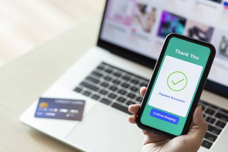 using smartphone and credit card online shoppingの写真素材