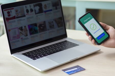 using smartphone and credit card online shoppingの写真素材