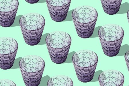 glasses goblets and pattern on green backgroundの写真素材