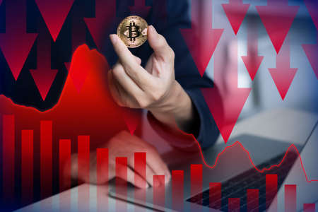 Male using laptop investment in bitcoin crypto currency blockchain technology trading conceptの写真素材