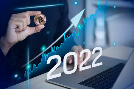 Male using laptop investment in bitcoin crypto currency blockchain technology trading conceptの写真素材