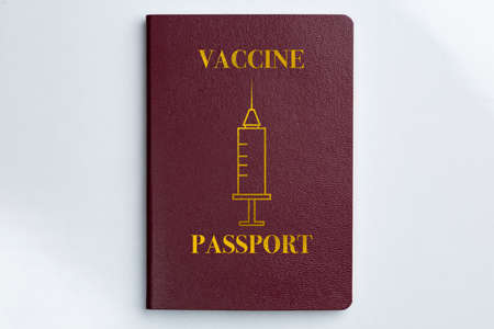 covid 19 Vacine passport certificate book on white backgroundの写真素材