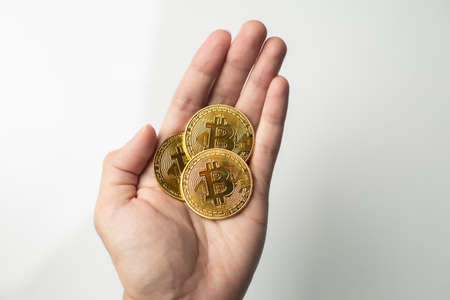 Male holding investment in bitcoin crypto currency blockchain technology tradingの写真素材