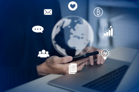 man using smartphone and laptop to do online transactions with data connection around the world by...
