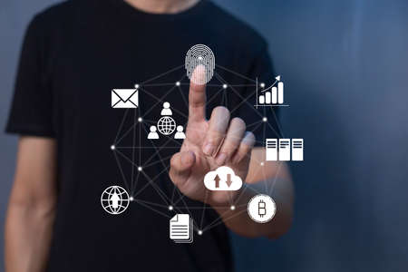 Person touching virtual screen to scan fingerprints, digital transformation management concept. Internet of Things, Big Data and Business Processes, Automation, Storage Systems, Cloud Computingの写真素材