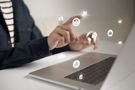 Businessman touches virtual screen technology to do online transactions via internet Connect data to...