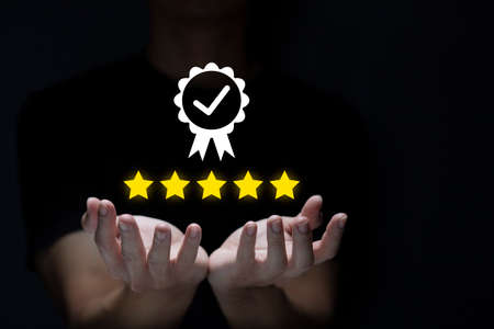 Businessman showing sign of leading service, 5 star quality assurance, warranty, standardization,...