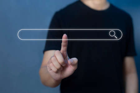 Search technology, search engine optimization, man's hand using virtual to search information, using...