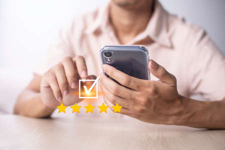 Satisfaction and customer service survey concept, business people using  smartphone. to answer the...